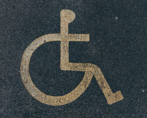 a handicap sign painted on the ground